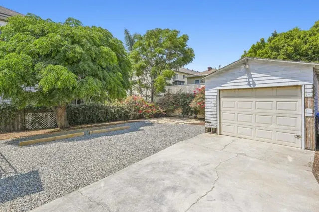 a view of a house with a yard and garage