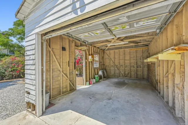 a view of a garage with an outdoor space