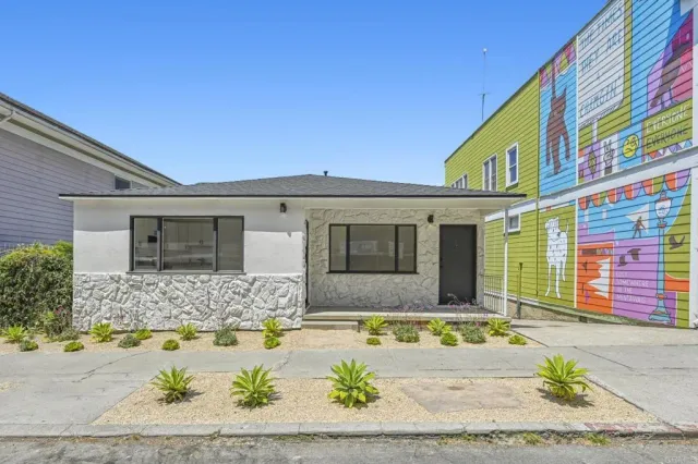 a view of house with outdoor seating