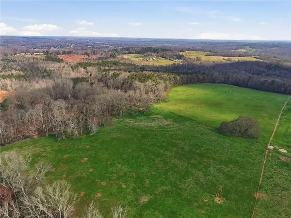 a view of a lake with a yard