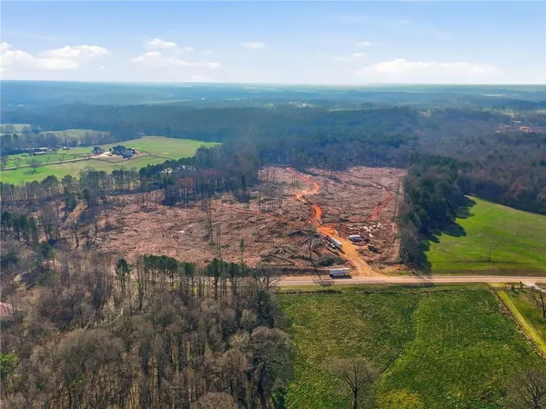 a view of a lake with a yard