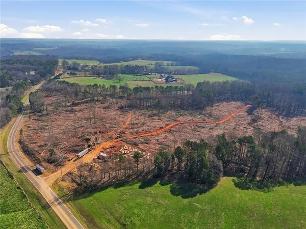 a view of a field with an trees
