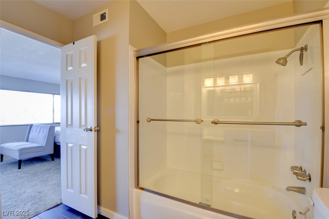 745 North Royal Crest Circle, Unit 127 Las Vegas, NV 89169 - Photo 25 of 26 Bathroom featuring shower / bath combination with glass door