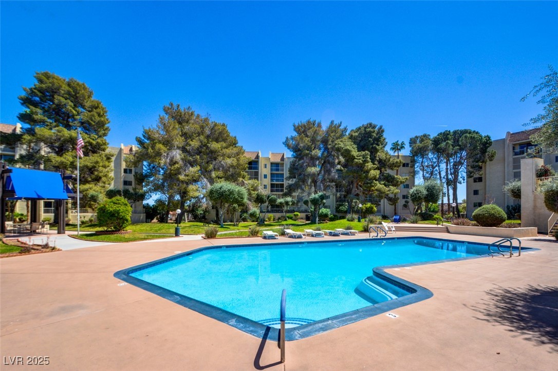 745 North Royal Crest Circle, Unit 127 Las Vegas, NV 89169 - Photo 5 of 26 Community pool with a patio area