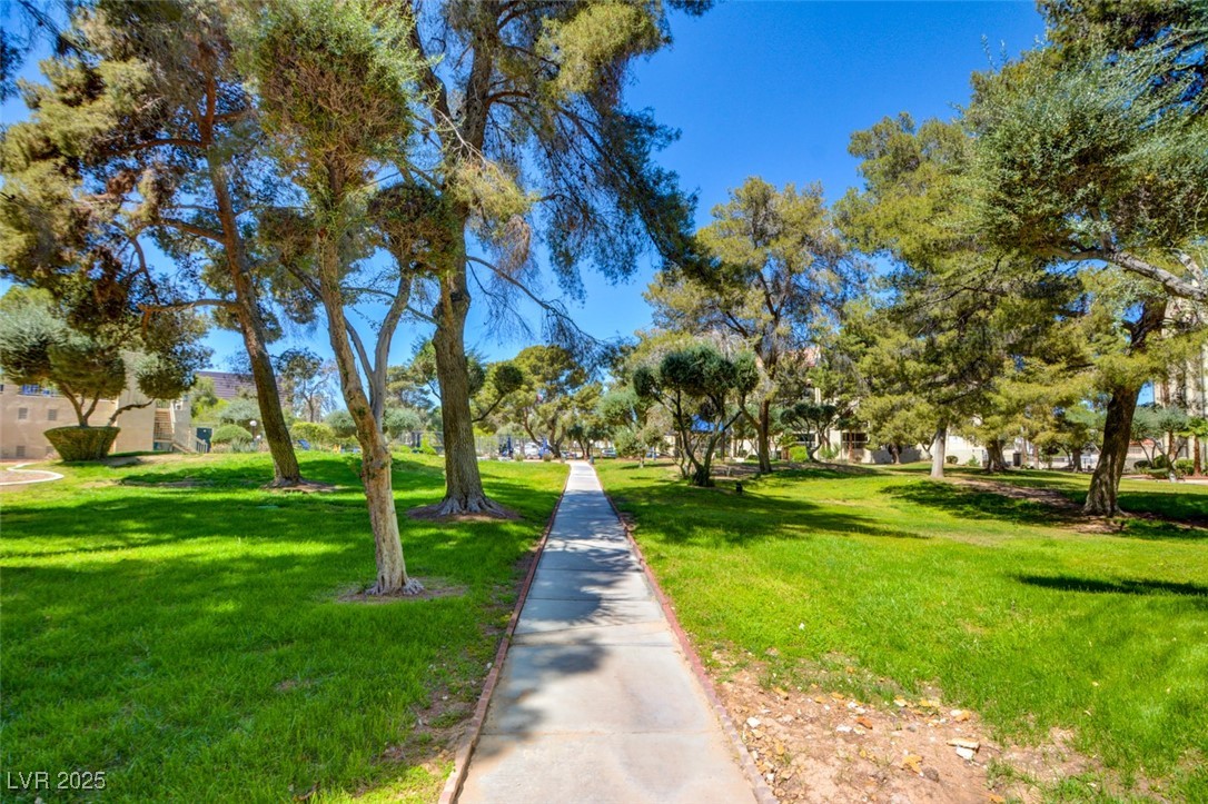 745 North Royal Crest Circle, Unit 127 Las Vegas, NV 89169 - Photo 6 of 26 View of property's community featuring a yard