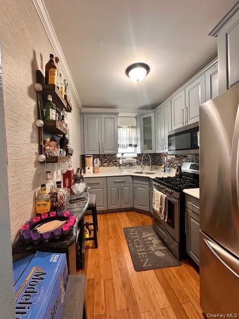 169,34 144th Road Queens, NY 11434 - Photo 11 of 17 a kitchen with stainless steel appliances granite countertop a sink stove and refrigerator