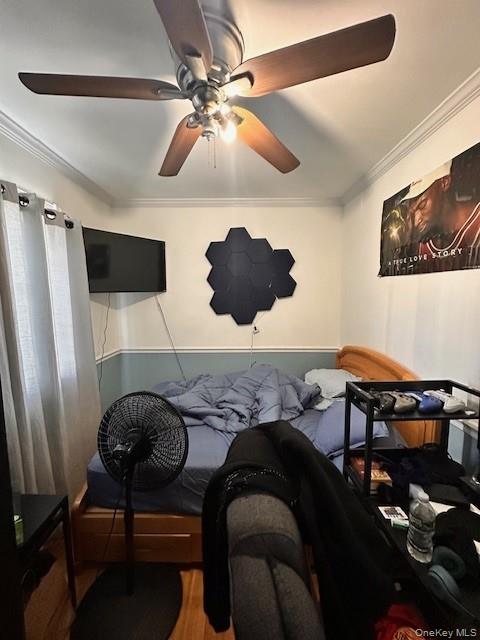 169,34 144th Road Queens, NY 11434 - Photo 15 of 17 a bedroom with a bed and a chandelier