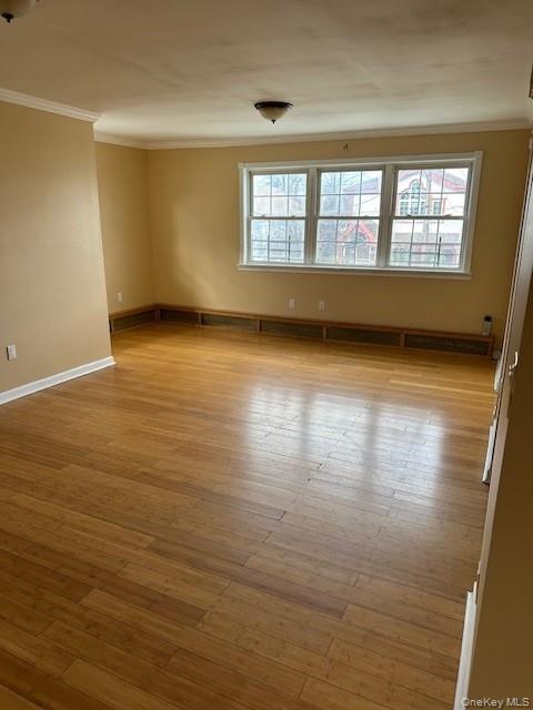 169,34 144th Road Queens, NY 11434 - Photo 3 of 17 wooden floor in an empty room with a window