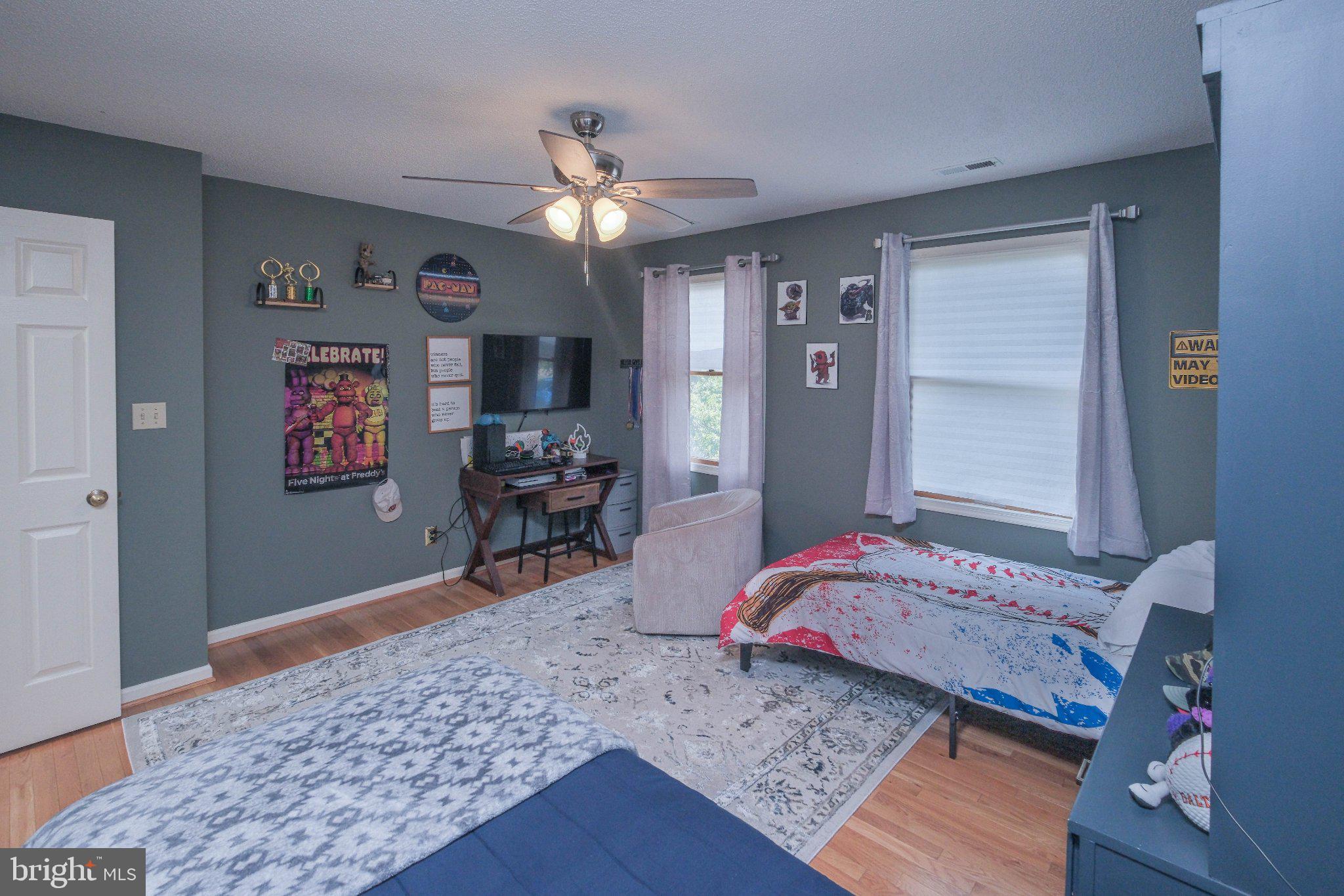 1163 Tasker Road Stephens City, VA 22655 - Photo 28 of 46 Charming bedroom with modern flair.