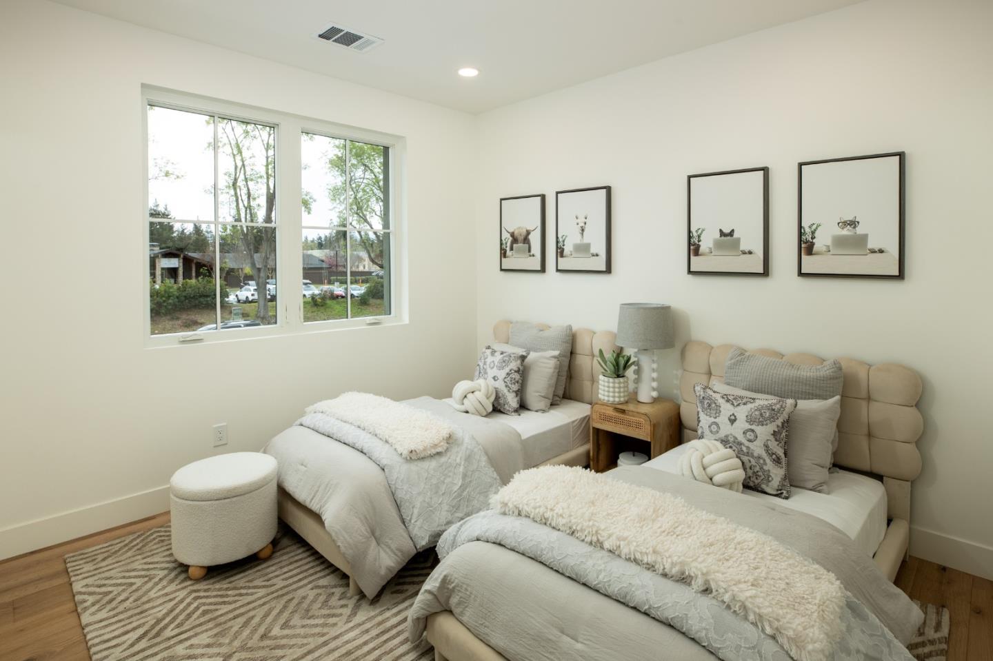 1693 Waterbird Way Sunnyvale, CA 94087 - Photo 19 of 31 a bedroom with two beds and painting on the wall