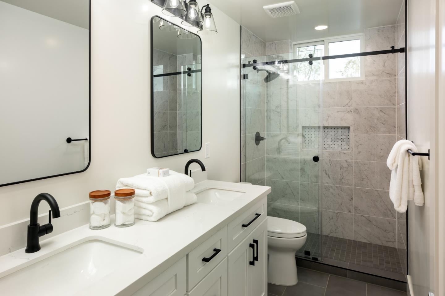 1693 Waterbird Way Sunnyvale, CA 94087 - Photo 21 of 31 a bathroom with a double vanity sink toilet and shower
