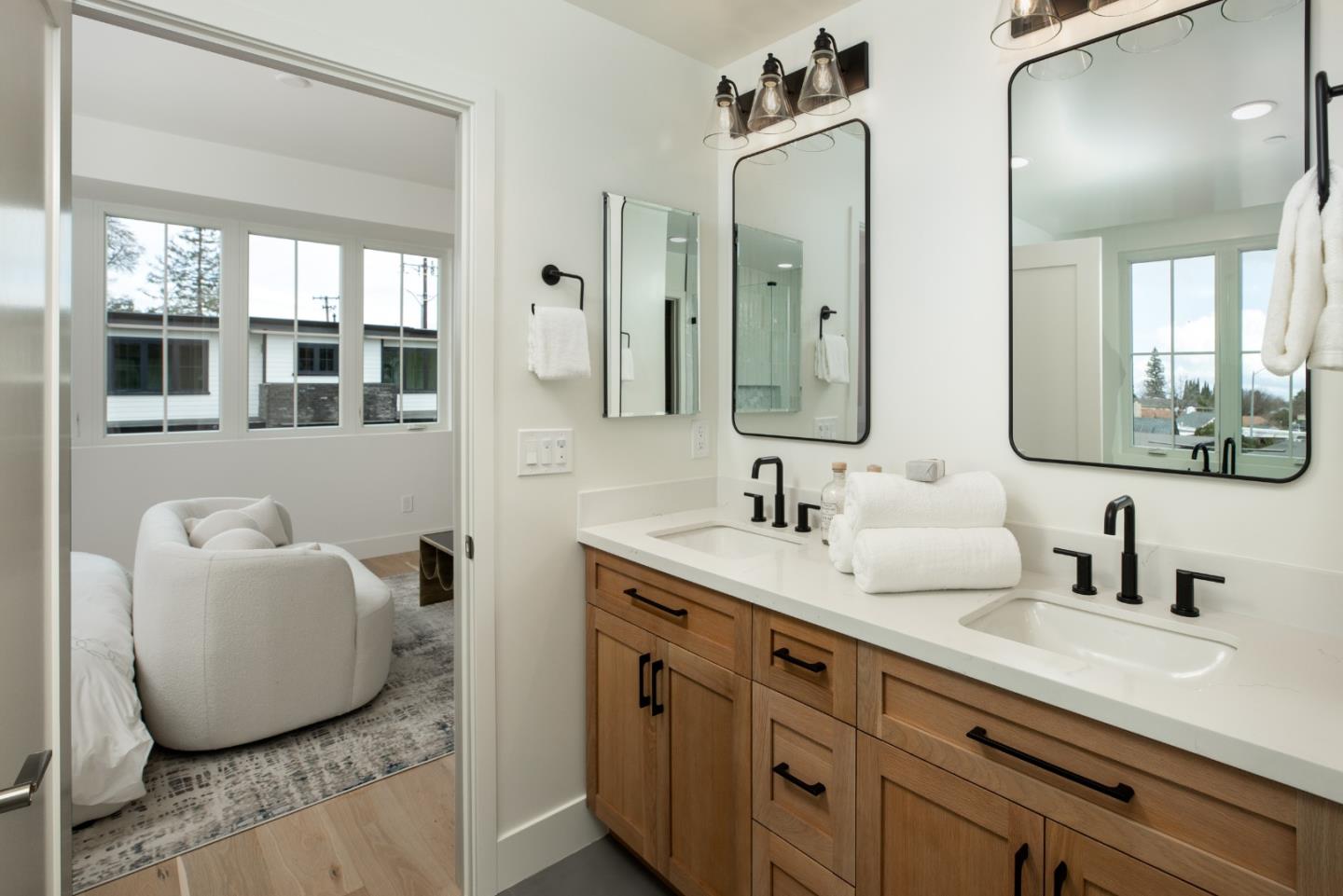 1693 Waterbird Way Sunnyvale, CA 94087 - Photo 23 of 31 a bathroom with a granite countertop sink mirror and double