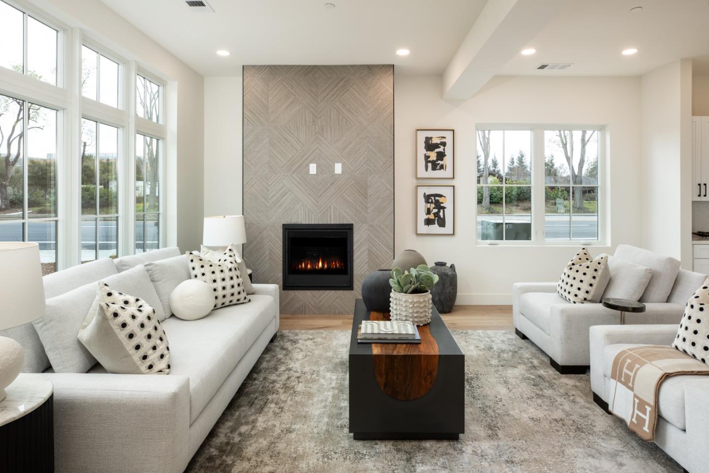 1693 Waterbird Way Sunnyvale, CA 94087 - Photo 4 of 31 a living room with furniture and a fireplace