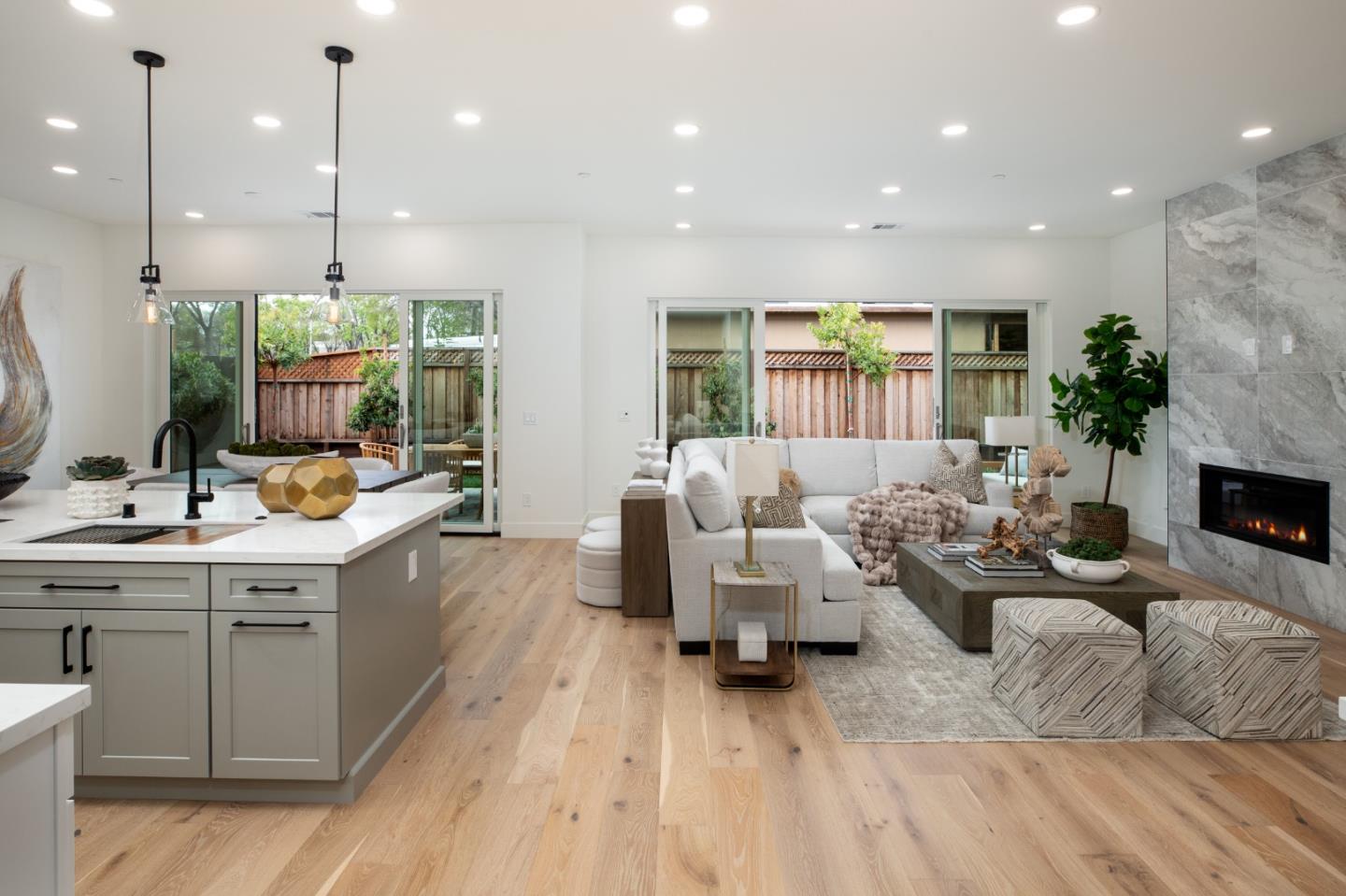 1693 Waterbird Way Sunnyvale, CA 94087 - Photo 6 of 31 a living room with furniture kitchen view and a large window
