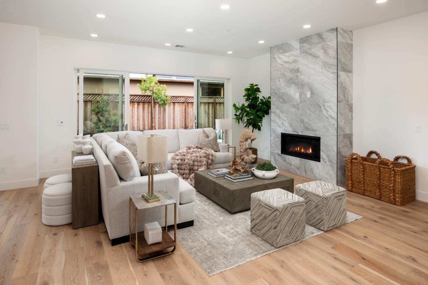 1693 Waterbird Way Sunnyvale, CA 94087 - Photo 7 of 31 a living room with furniture and a fireplace
