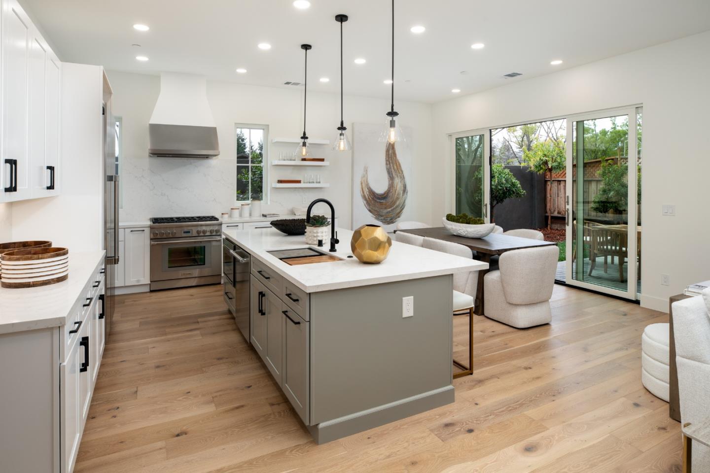 1693 Waterbird Way Sunnyvale, CA 94087 - Photo 9 of 31 a kitchen with a sink stove and cabinets