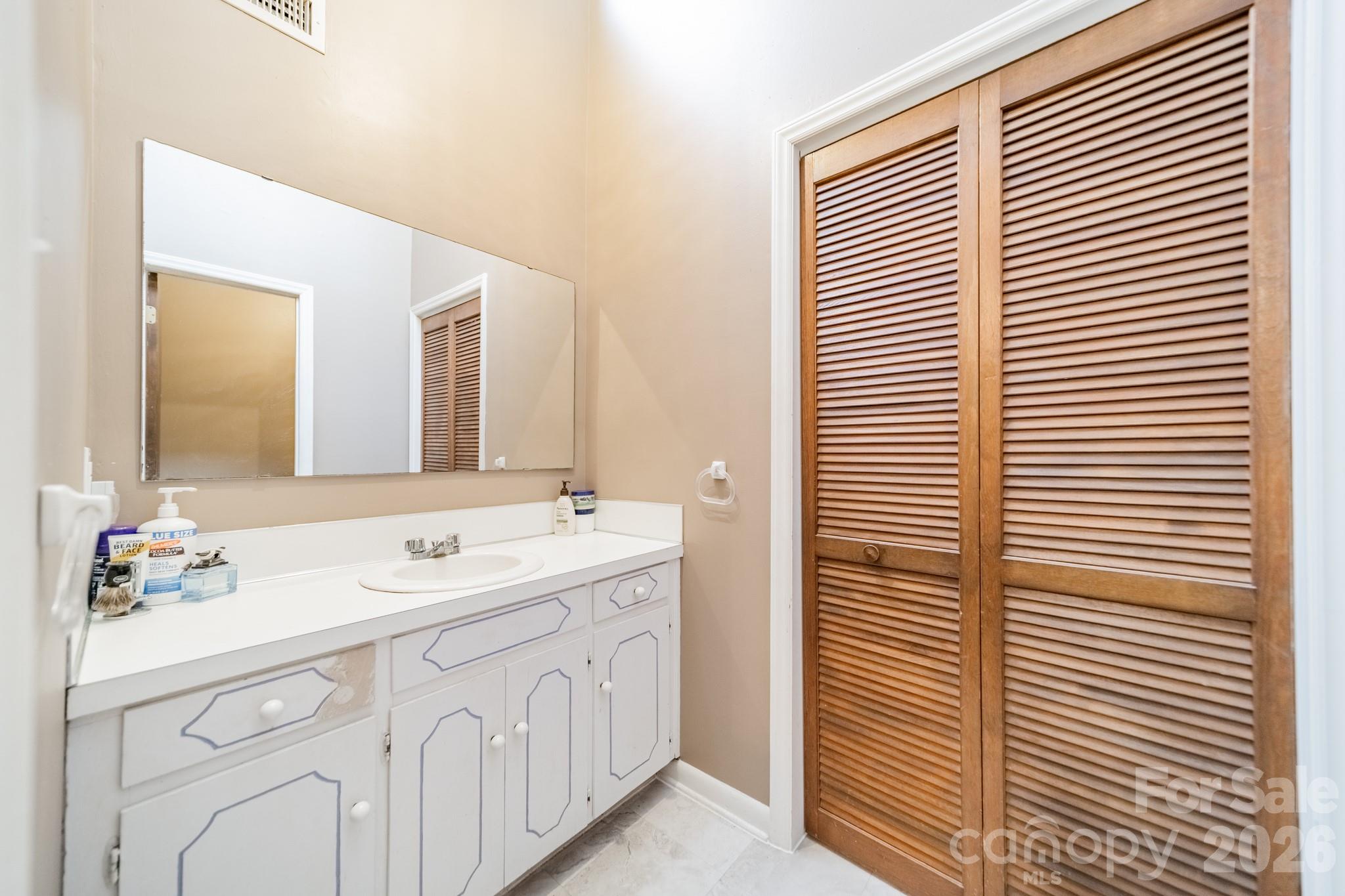 6524 The Little Road Waxhaw, NC 28173 - Photo 20 of 25 a bathroom with a sink and a mirror