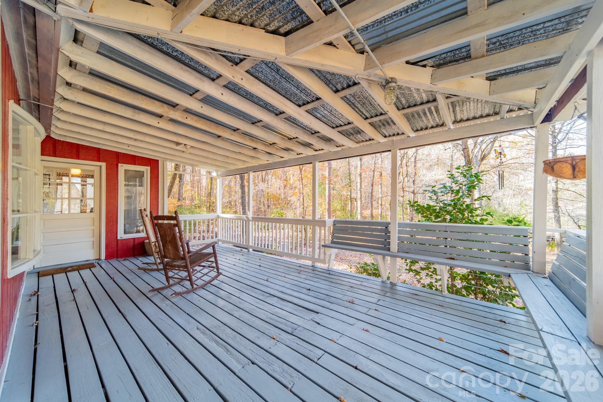 6524 The Little Road Waxhaw, NC 28173 - Photo 2 of 25 a chair and table sitting in wooden floor