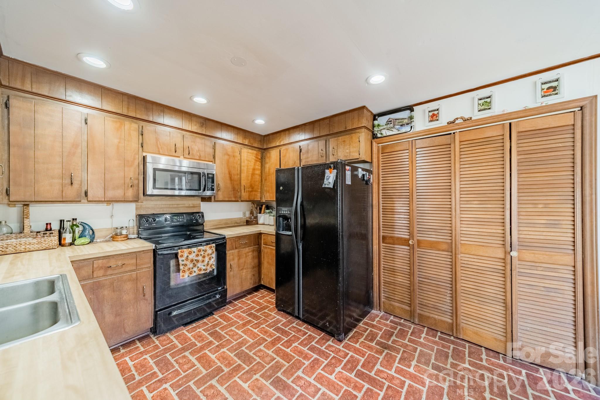 6524 The Little Road Waxhaw, NC 28173 - Photo 21 of 25 a kitchen with stainless steel appliances granite countertop a refrigerator and a sink