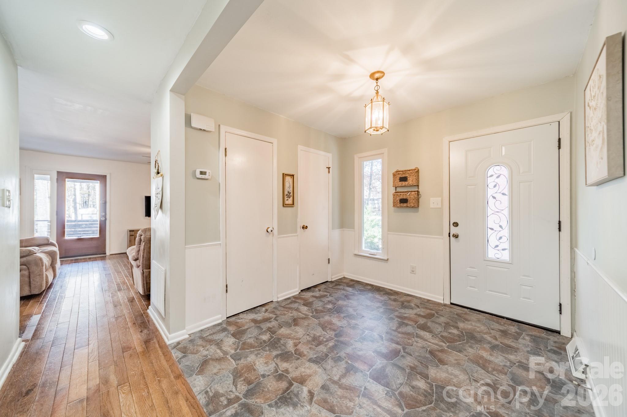 6524 The Little Road Waxhaw, NC 28173 - Photo 4 of 25 wooden floor in an empty room with a window