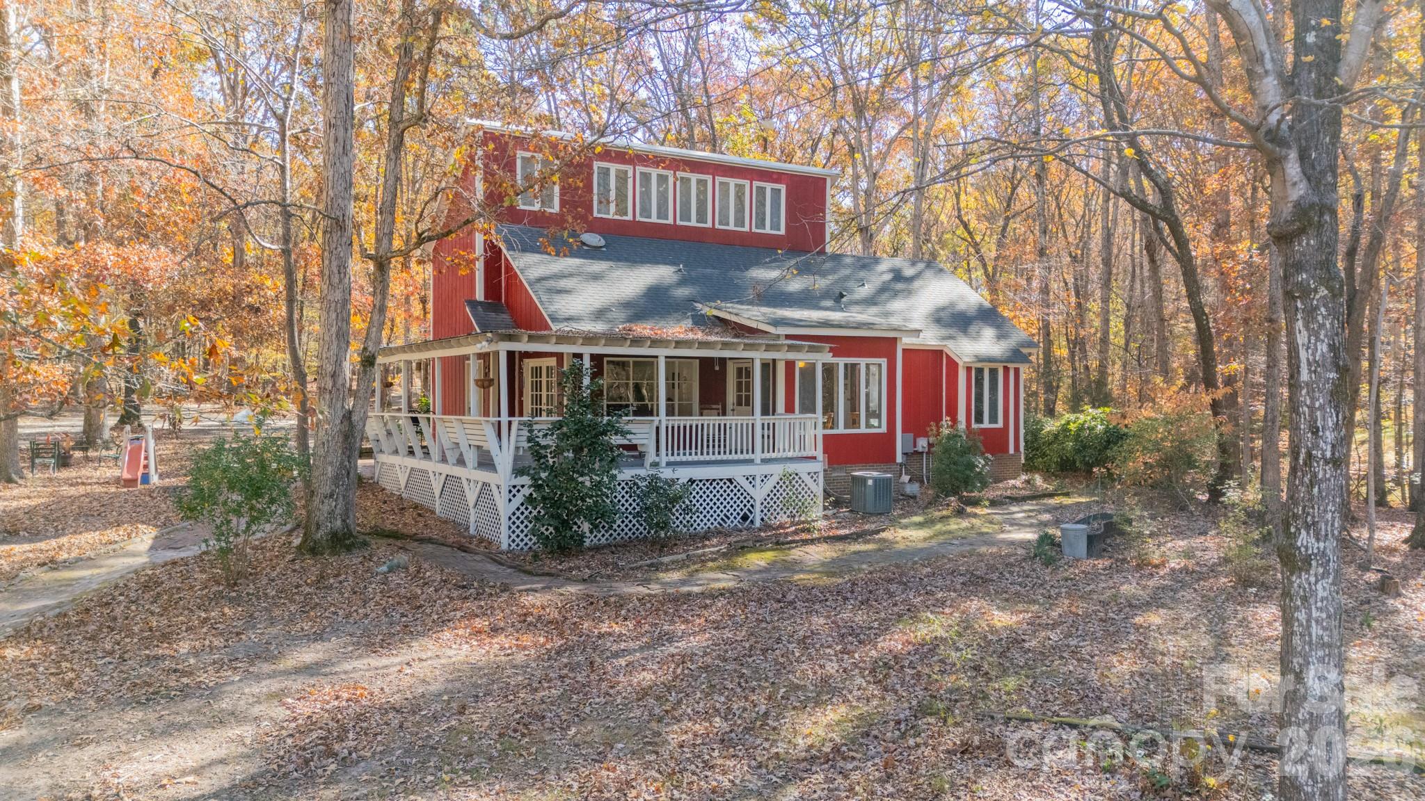 6524 The Little Road Waxhaw, NC 28173 - Photo 5 of 25 a view of a house with a yard and wooden fence