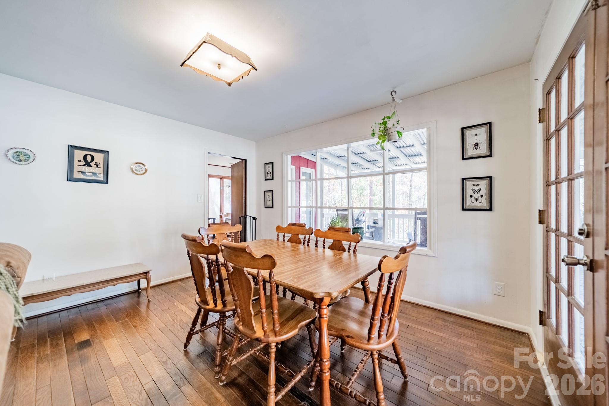 6524 The Little Road Waxhaw, NC 28173 - Photo 6 of 25 a view of a dining room with furniture window and wooden floor