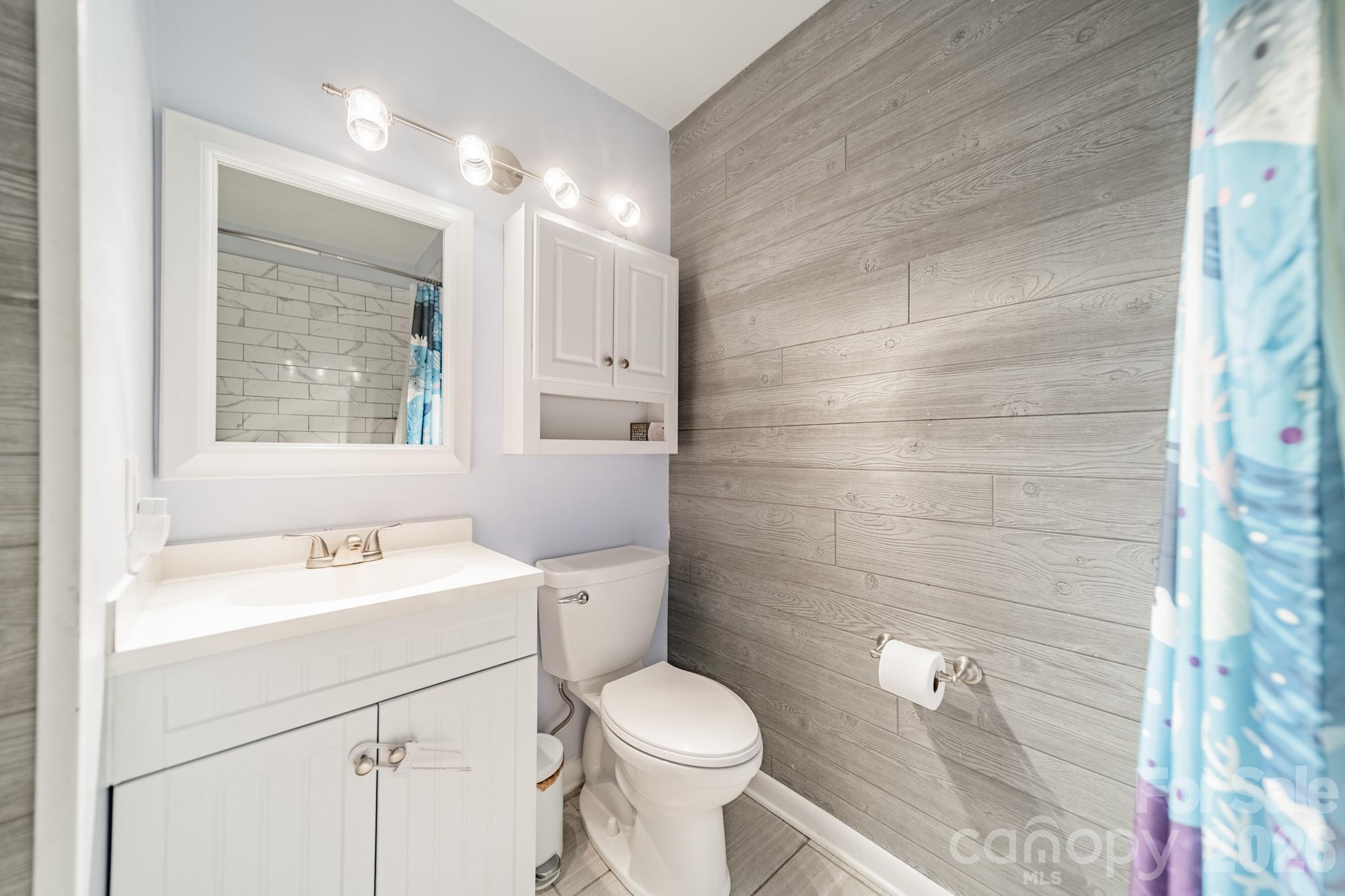6524 The Little Road Waxhaw, NC 28173 - Photo 9 of 25 a bathroom with a sink toilet vanity and shower