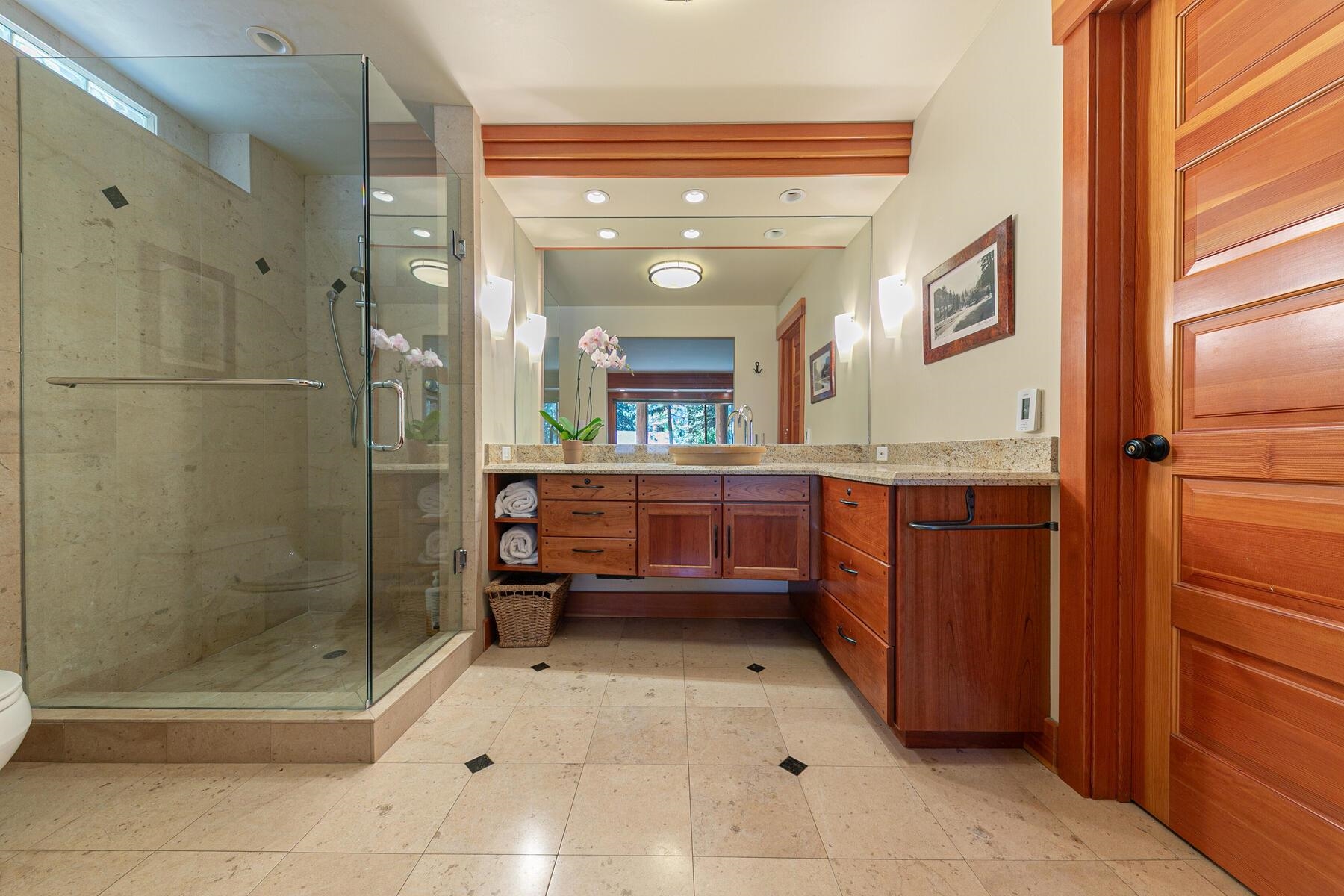 1221 Sandy Way Olympic Valley, CA 96146 - Photo 20 of 28 a bathroom with a mirror a shower and a sink