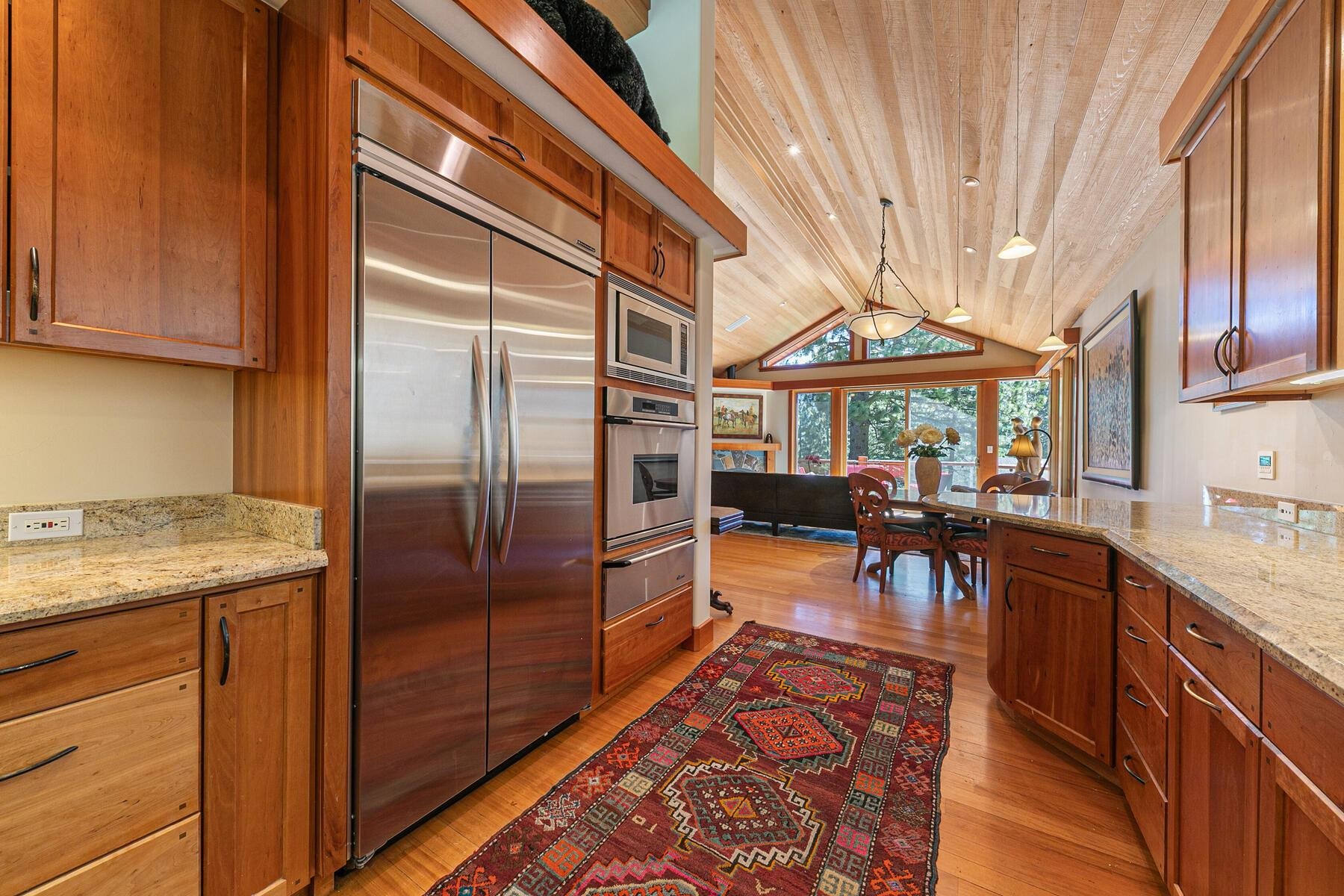 1221 Sandy Way Olympic Valley, CA 96146 - Photo 4 of 28 a kitchen with stainless steel appliances granite countertop a refrigerator and a stove