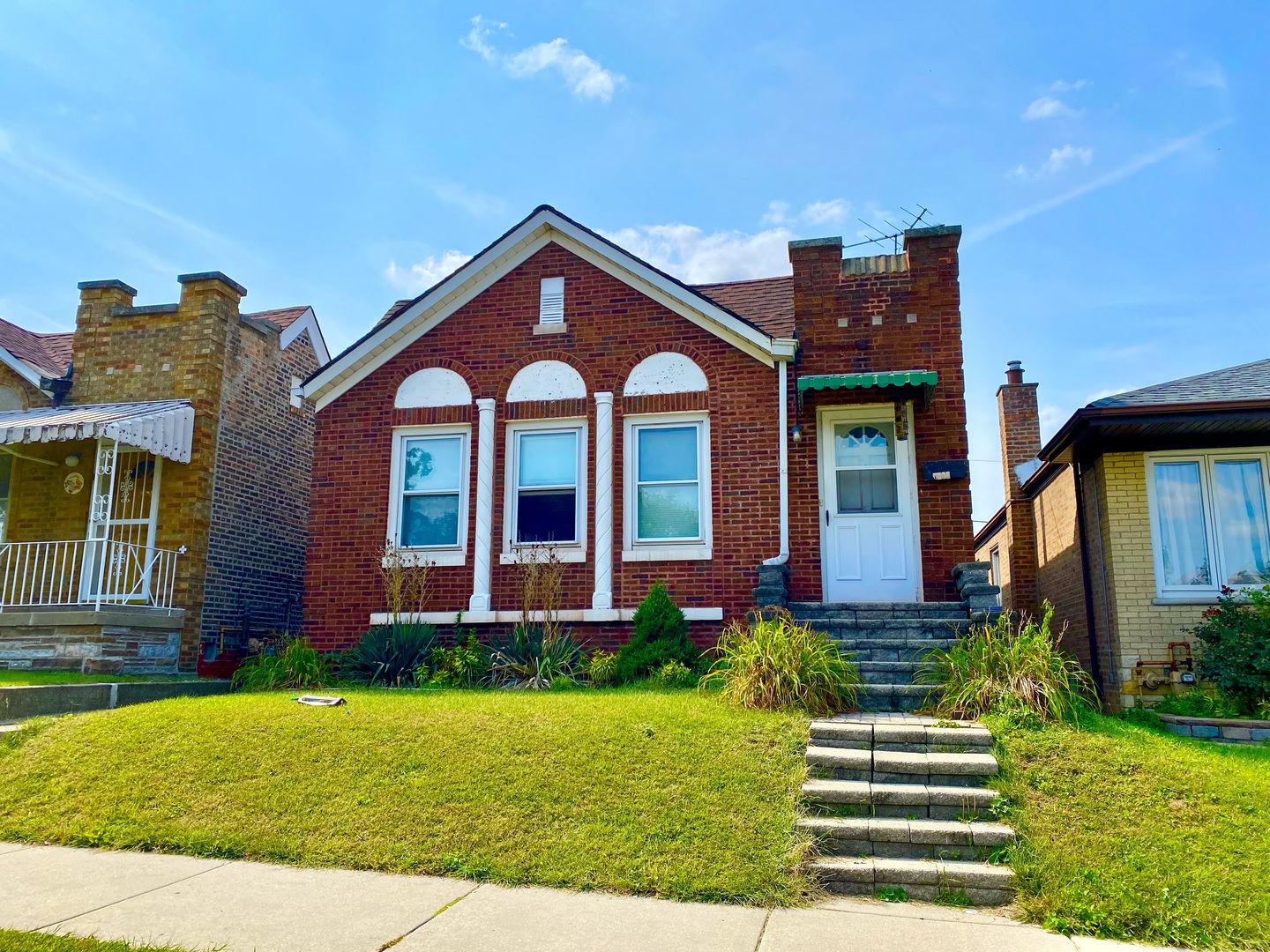 6550 South Kilpatrick Avenue Chicago, IL 60629 - Photo 1 of 7 a front view of a house with a yard