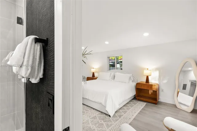 a bedroom with a bed and a night lamp