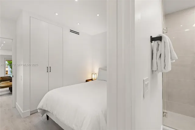 a bed room with a bed and a television