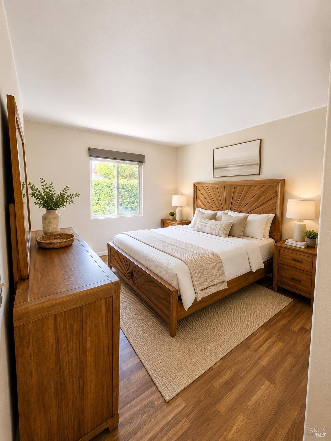 1945 Piner Road, Unit 16 Santa Rosa, CA 95403 - Photo 11 of 18 a bedroom with a bed and a potted plant on dresser