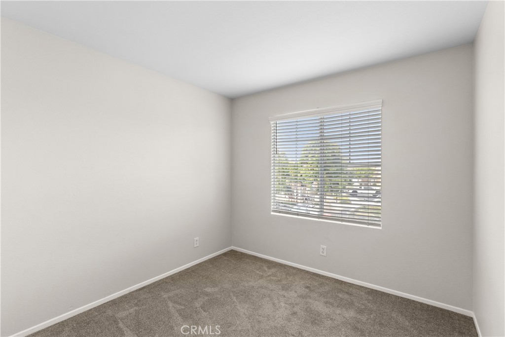 33657 Emerson Way, Unit C Temecula, CA 92592 - Photo 15 of 32 an empty room with a window