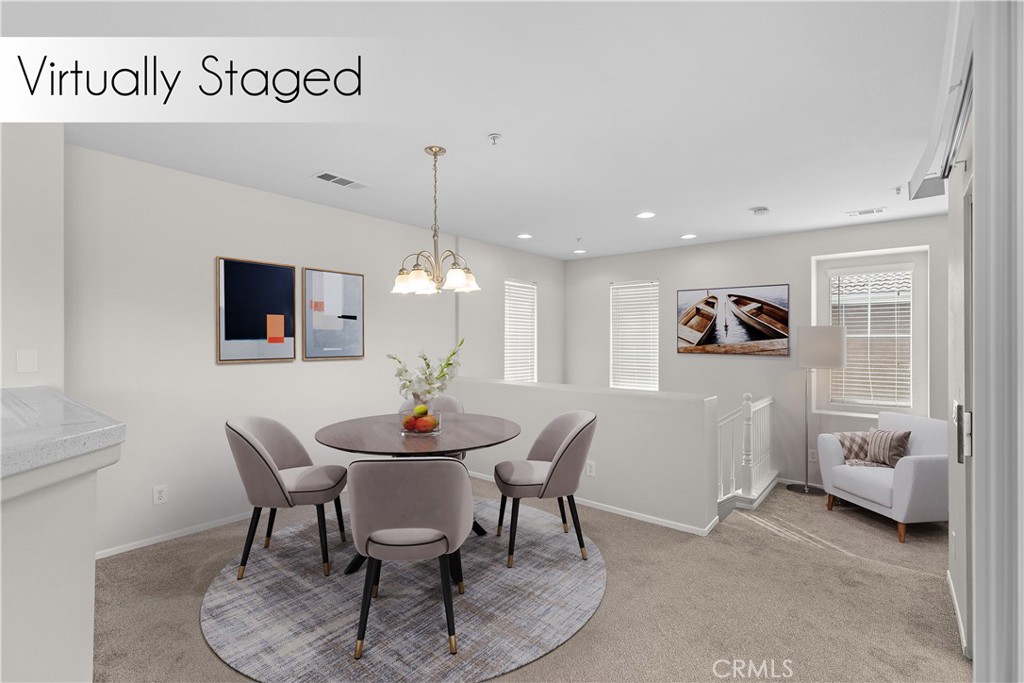 33657 Emerson Way, Unit C Temecula, CA 92592 - Photo 2 of 32 a view of a dining room with furniture and a chandelier
