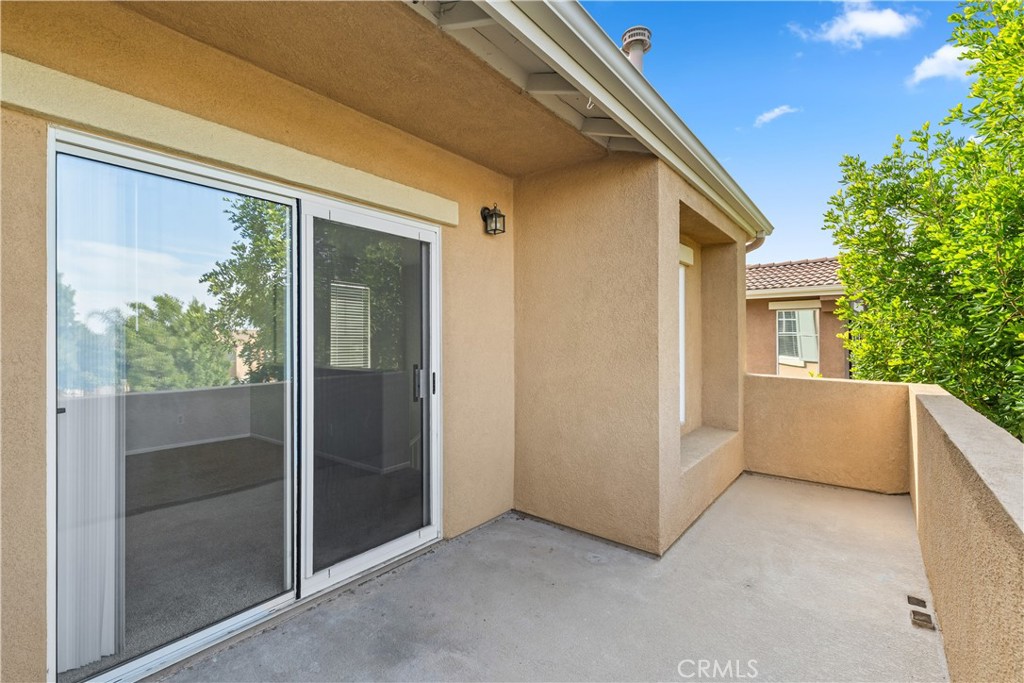 33657 Emerson Way, Unit C Temecula, CA 92592 - Photo 22 of 32 a view of a house with backyard and windows