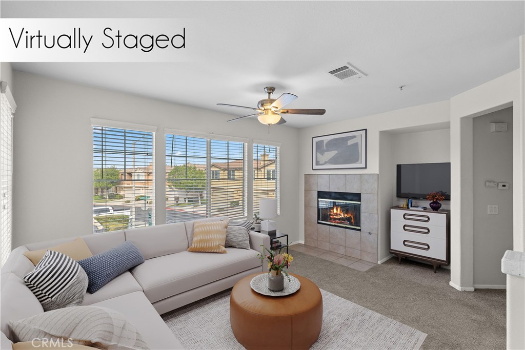 33657 Emerson Way, Unit C Temecula, CA 92592 - Photo 4 of 32 a living room with furniture a window and a flat screen tv