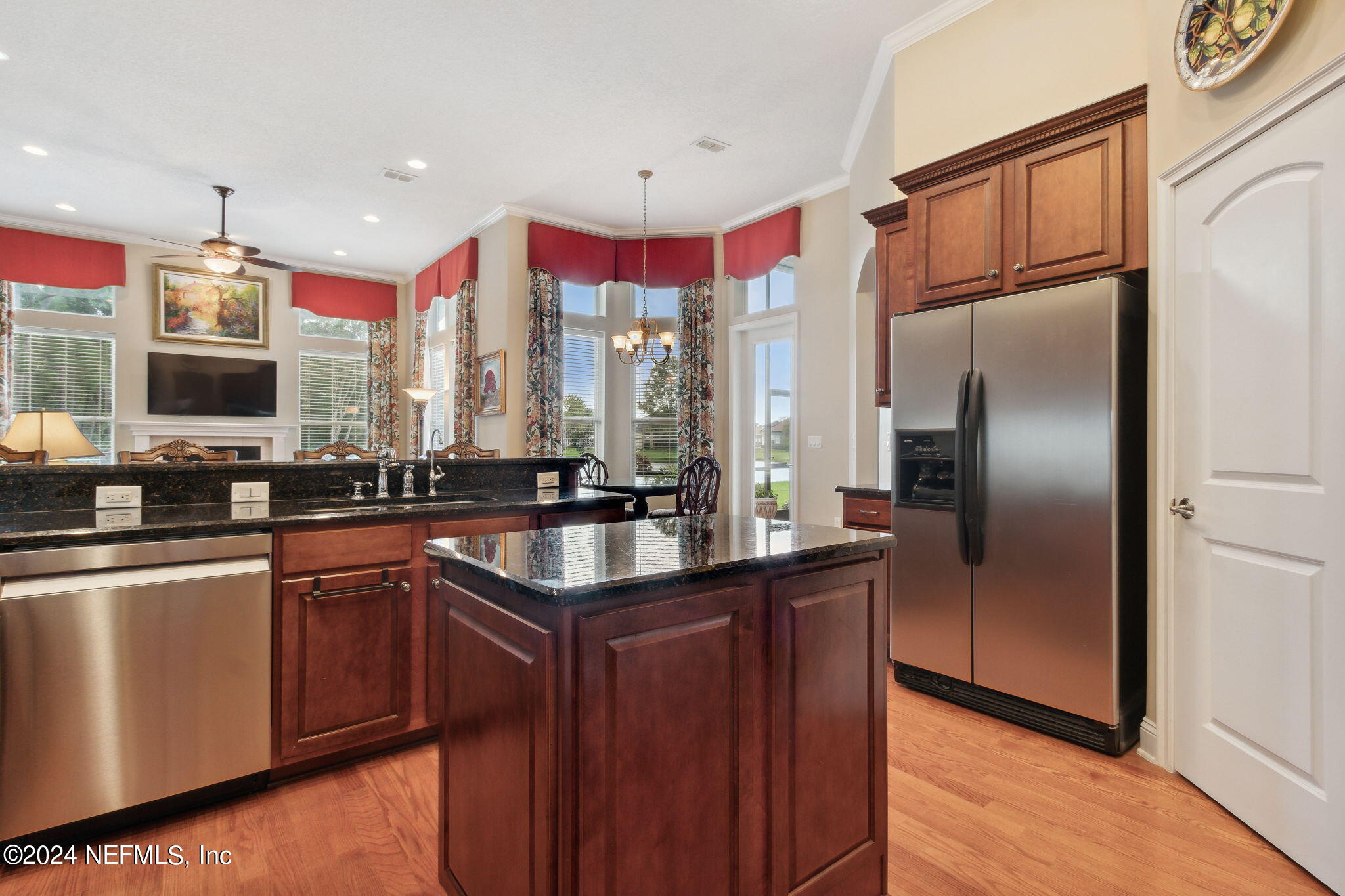 270 Holland Drive St. Augustine, FL 32095 - Photo 13 of 60 a kitchen with stainless steel appliances granite countertop a refrigerator and a sink