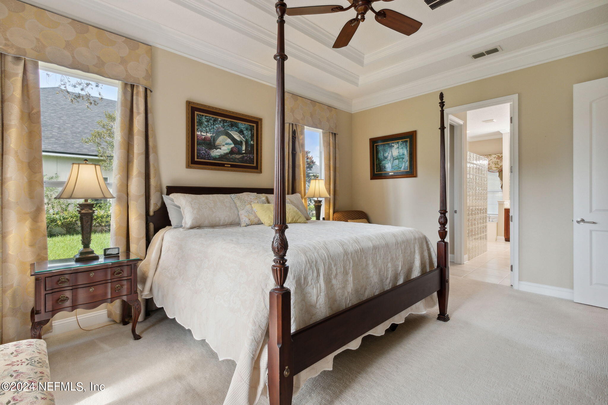 270 Holland Drive St. Augustine, FL 32095 - Photo 19 of 60 a bedroom with a bed and glass windows