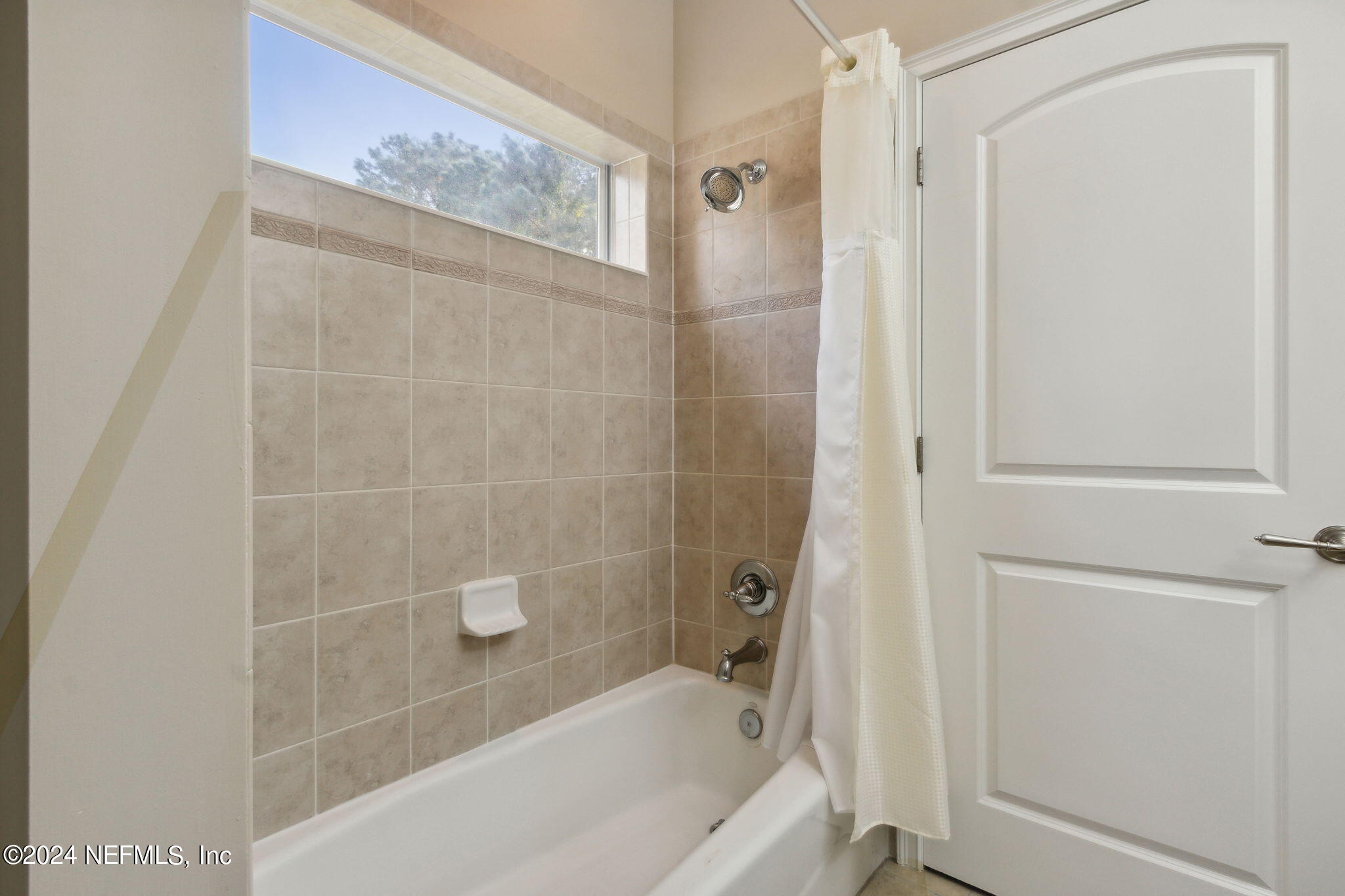 270 Holland Drive St. Augustine, FL 32095 - Photo 25 of 60 a bathroom with a bathtub and a shower