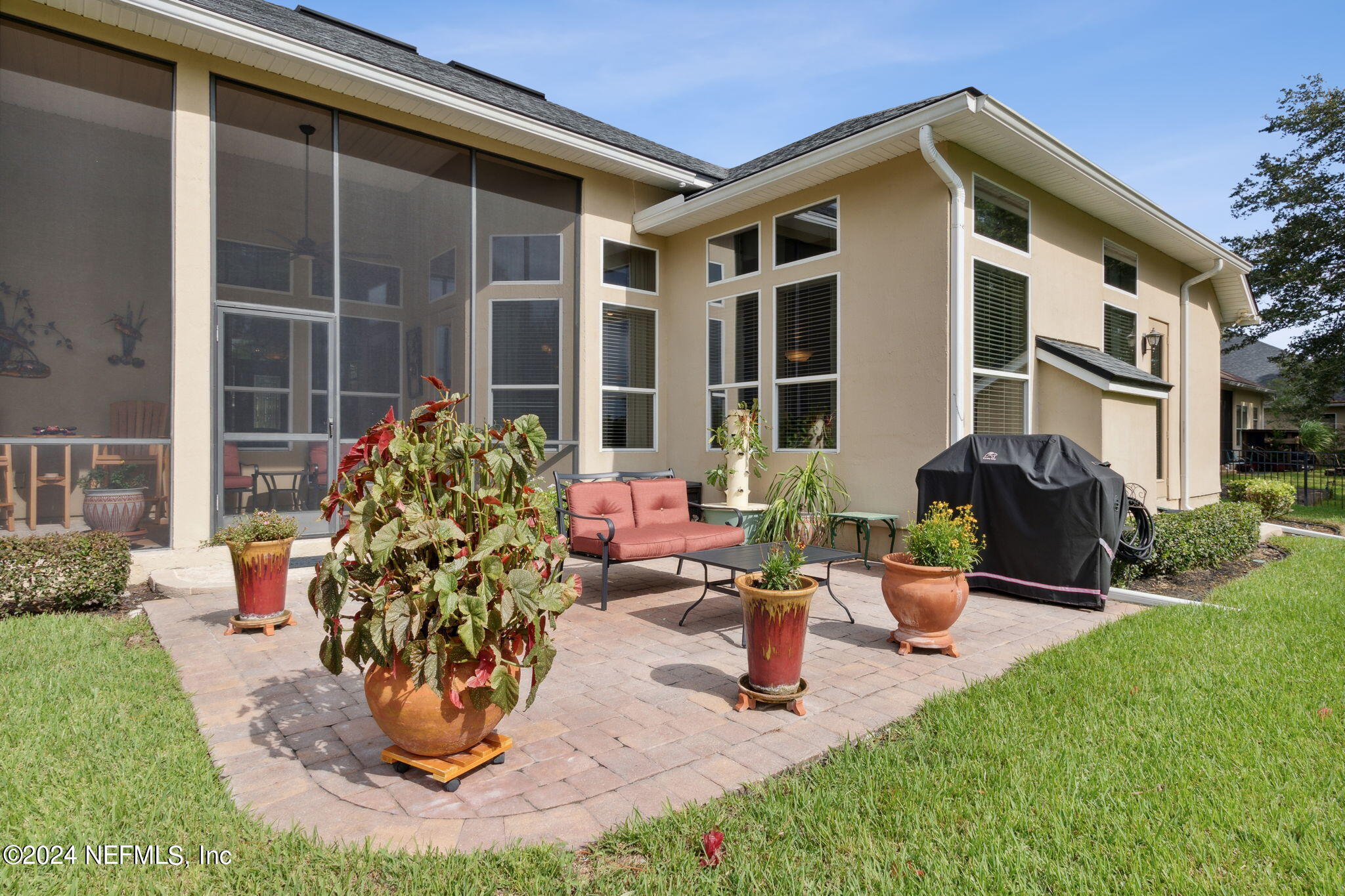 270 Holland Drive St. Augustine, FL 32095 - Photo 32 of 60 a front view of a house with a yard fountain and fire pit