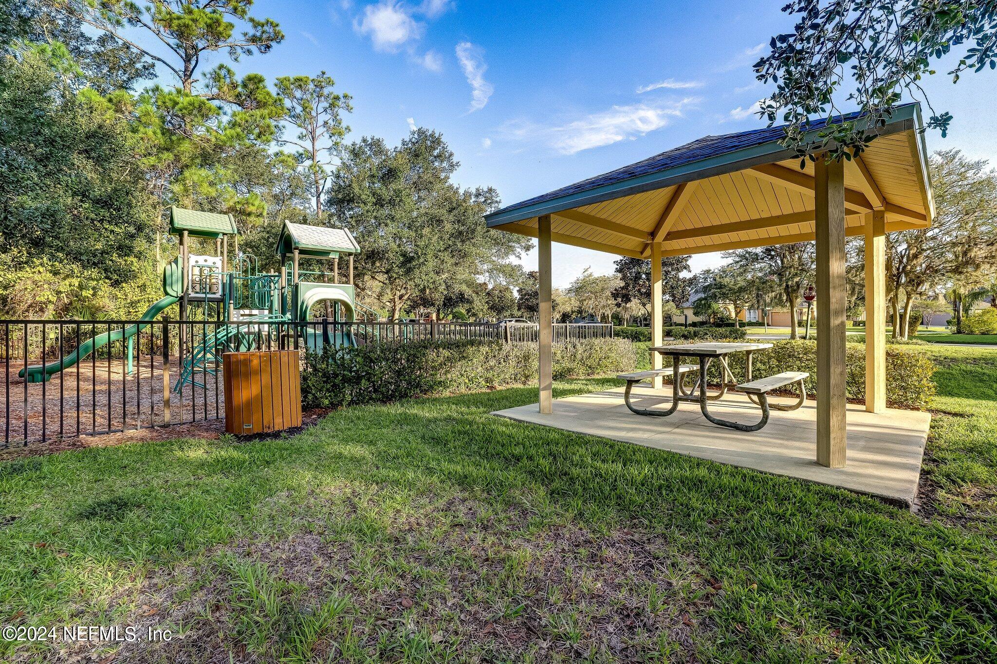 270 Holland Drive St. Augustine, FL 32095 - Photo 49 of 60 a view of swimming pool with sitting area and garden