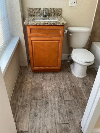 a bathroom with a toilet and a sink