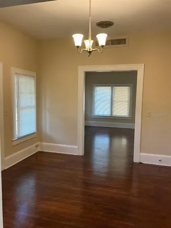 a view of a livingroom with wooden floor