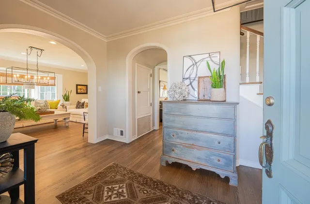 a view of kitchen and dining room with furniture wooden floor and a fireplace