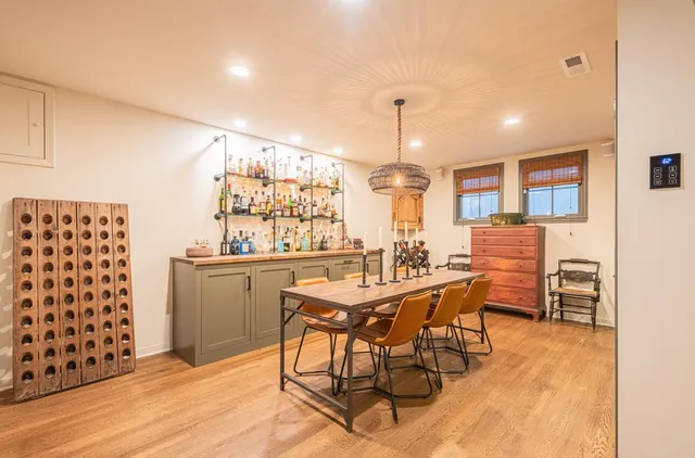 a view of a house with backyard sitting area and garden