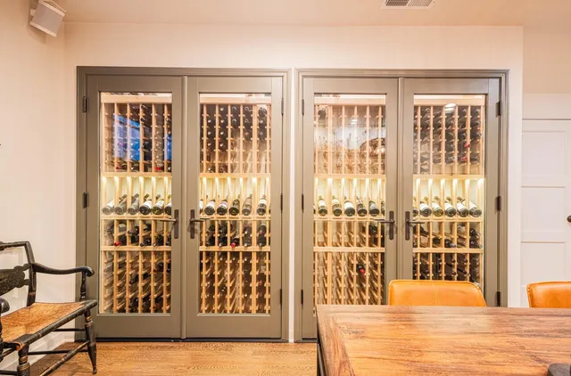 an aerial view of residential houses with outdoor space and parking