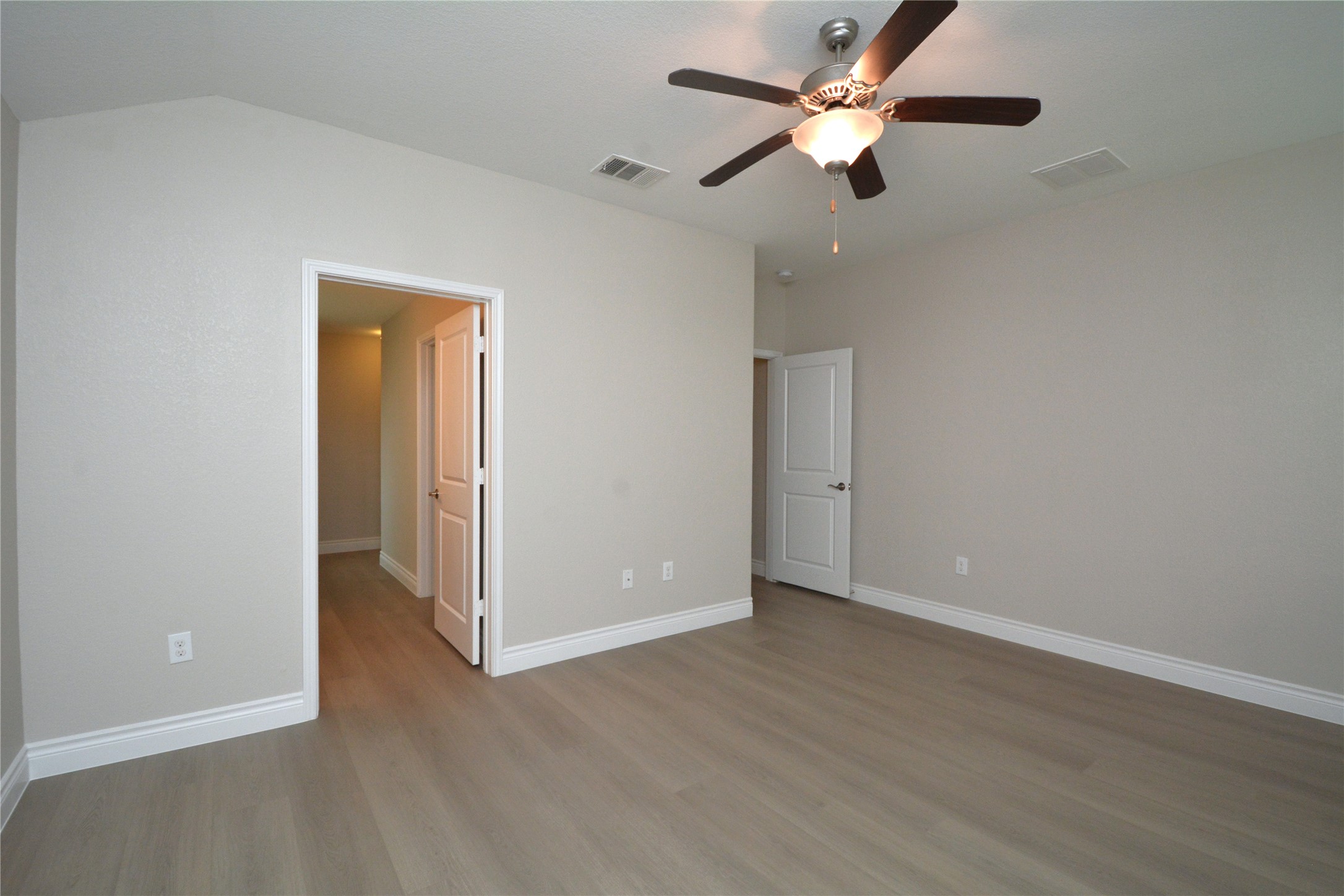 3901 Colorado High Avenue Austin, TX 78744 - Photo 13 of 39 an empty room with closet and a ceiling fan