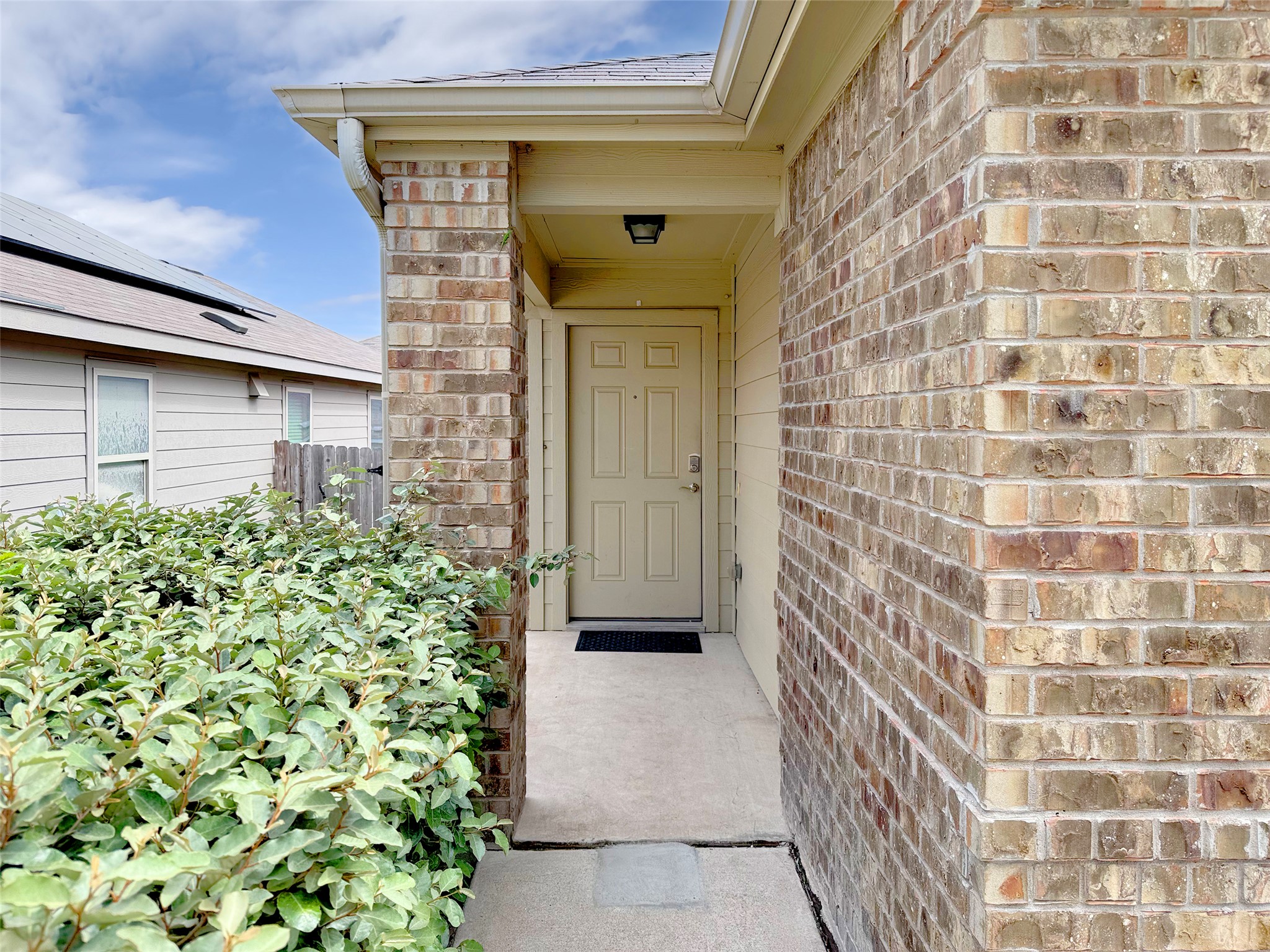 3901 Colorado High Avenue Austin, TX 78744 - Photo 2 of 39 a front view of a house with a garden