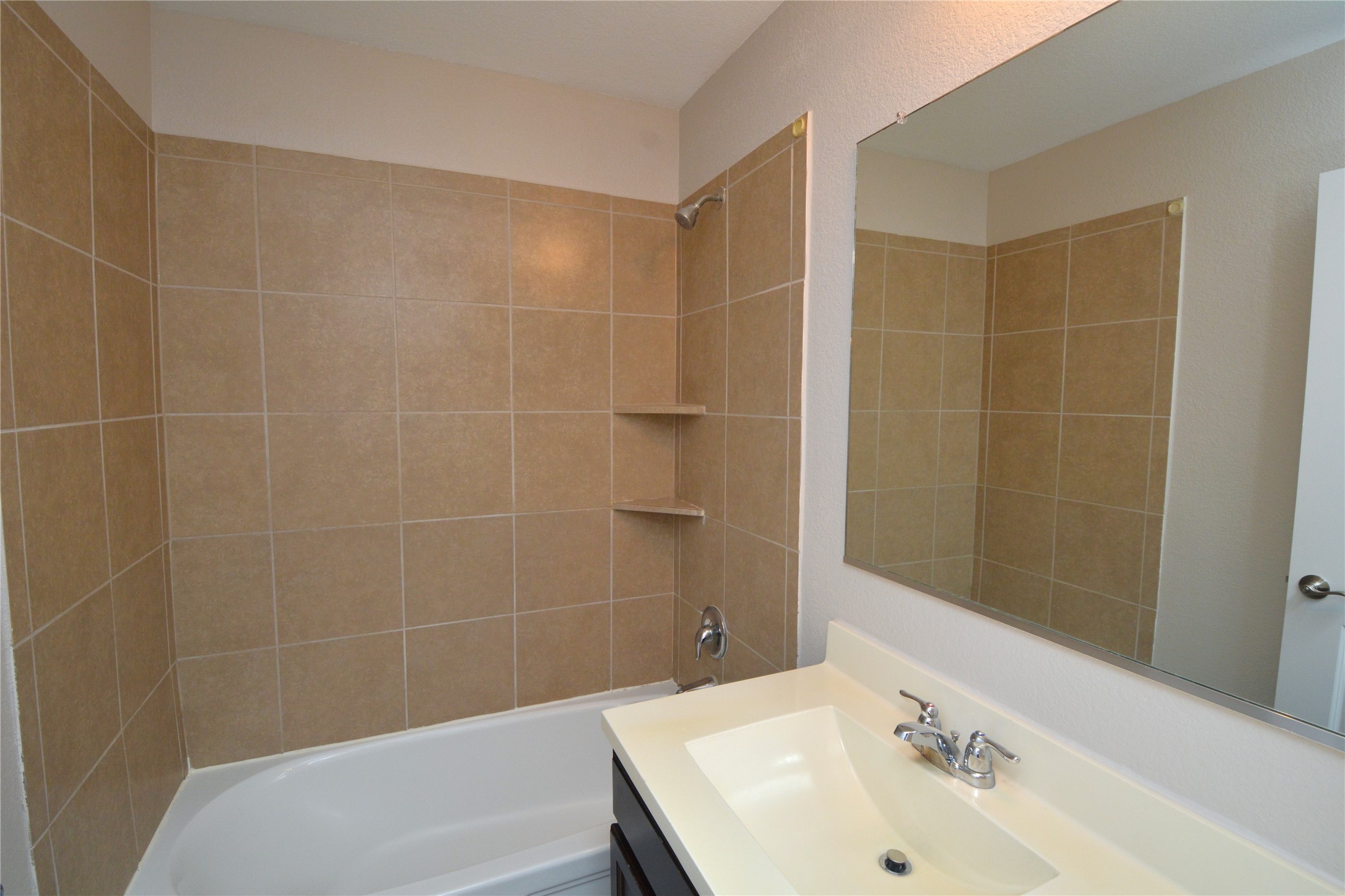 3901 Colorado High Avenue Austin, TX 78744 - Photo 29 of 39 a bathroom with a sink and shower